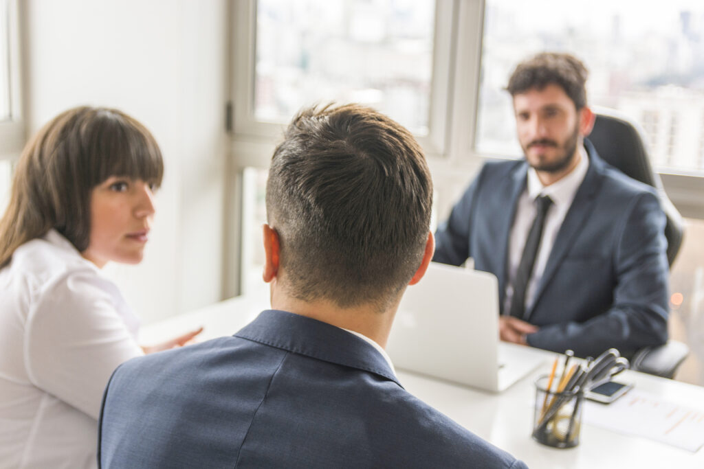 businessman businesswoman sitting front manager workplace